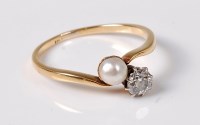Lot 2628 - A 'pearl' and diamond 'toi et moi' ring, the...