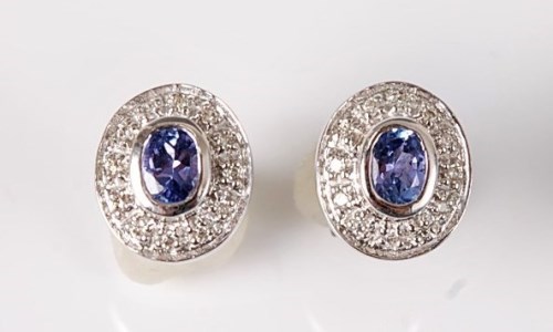 Lot 2632 - A pair of 9ct tanzanite and diamond earstuds,...
