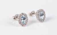 Lot 2633 - A pair of aquamarine and diamond cluster...
