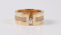 Lot 2635 - A diamond dress ring, the central round...