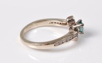 Lot 2641 - A treated blue and white diamond ring, the...