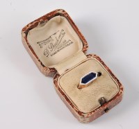 Lot 2644 - WITHDRAWN A synthetic sapphire and enamel ring,...