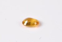 Lot 2646 - A loose oval cut yellow sapphire, measuring...