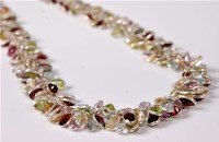 Lot 2649 - A multi gemset and silver necklace, the...