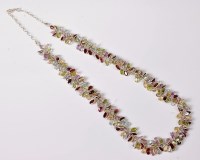 Lot 2649 - A multi gemset and silver necklace, the...