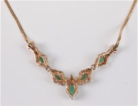 Lot 2656 - An emerald and diamond necklace, the five...