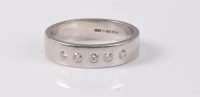 Lot 2663 - A platinum and diamond ring, the five round...