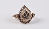 Lot 2680 - A 9ct diamond dress ring, the central pear...