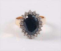Lot 2681 - A sapphire and diamond cluster ring, the deep...