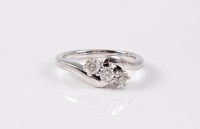 Lot 2692 - A three stone diamond ring, the three round...