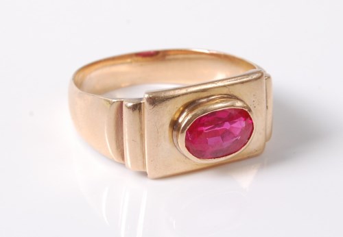 Lot 2715 - A synthetic pink sapphire ring, the oval pink...