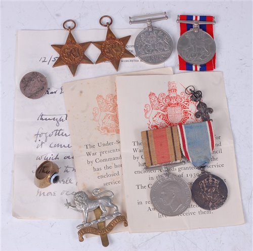 Lot 268 - A group of four WW II medals to include...
