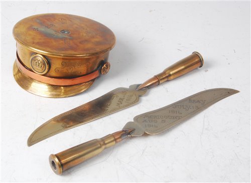 Lot 244 - A WW I trench art shell case desk weight in...