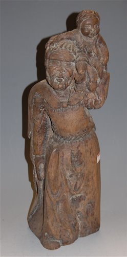 Lot 4 - A large carved oak figure of St Christopher in...