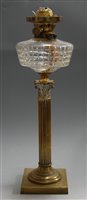 Lot 9 - An early 20th century oil lamp, having cut...