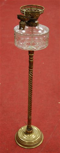 Lot 10 - An early 20th century brass pedestal oil lamp,...