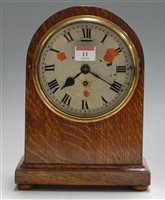 Lot 11 - An Edwardian oak cased dome-top mantel clock,...
