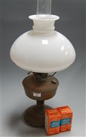 Lot 12 - An early 20th century brass pedestal oil lamp,...