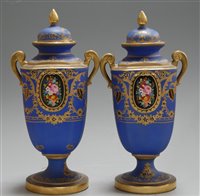 Lot 19 - A pair of Noritake pedestal urns and covers,...