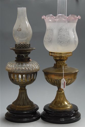 Lot 23 - An early 20th century brass pedestal oil lamp,...