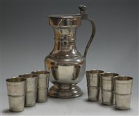 Lot 26 - A 1970s Continental pewter flagon, the hinged...