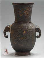 Lot 8 - A Chinese bronze vase having tapering neck to...