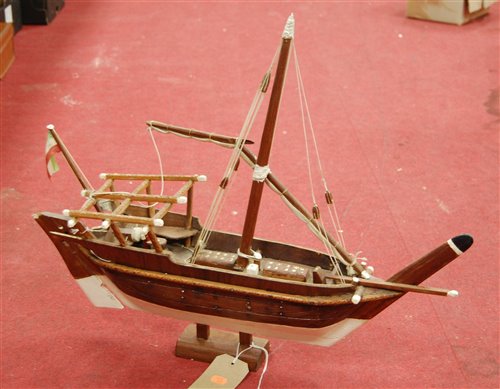 Lot 16 - A scratch-built wooden model of a sailboat