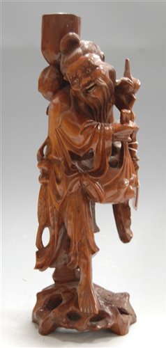 Lot 41 - A mid-20th century root carved figure of a...