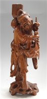Lot 41 - A mid-20th century root carved figure of a...