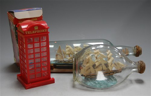 Lot 46 - A ship in a bottle on stand; together with one...