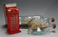Lot 46 - A ship in a bottle on stand; together with one...