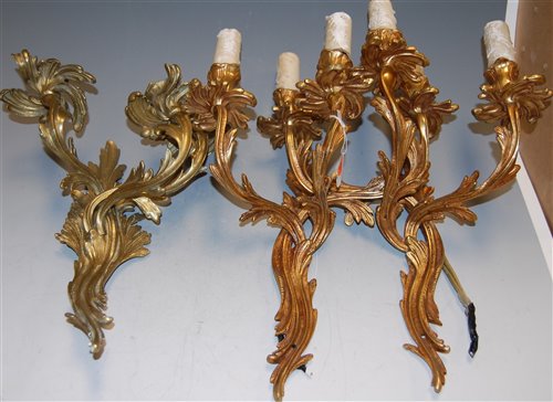 Lot 83 - A pair of Rococo style three branch gilt metal...