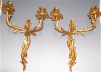 Lot 135 - A set of four Rococo style gilt metal twin...