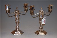 Lot 228 - A pair of silver two light candelabra each in...