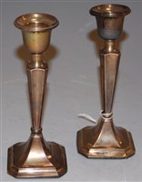 Lot 233 - A pair of George V silver candlesticks...