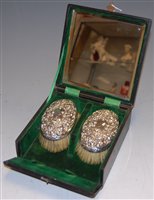 Lot 234 - A pair of Edwardian silver backed handbrushes...