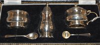 Lot 240 - An Elizabeth II silver three piece cruet in...