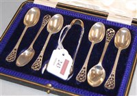 Lot 243 - A set of 6 George V silver teaspoons with...