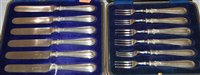 Lot 244 - A cased set of 6 silver handled fish forks...