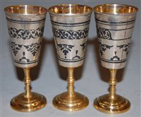 Lot 281 - A cased set of three Russian vodka cups