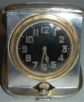 Lot 287 - A mid-20th century silver cased travel alarm...