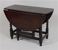 Lot 2626 - A circa 1700 joined oak gateleg table, having...