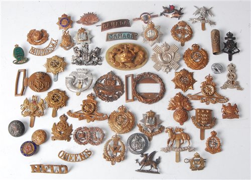 Lot 137 - A collection of cap badges and insignia, to...