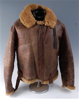 Lot 153 - A WW II brown leather flying jacket, with...