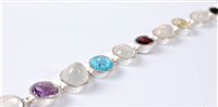 Lot 2647 - A silver and multi gemset bracelet, the mixed...