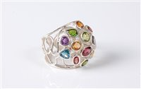 Lot 2617 - A multi gemset bombe ring, the mixed cut...