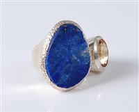Lot 2631 - A lapis lazuli and citrine ring, the rough cut...