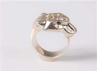Lot 2667 - A panther ring, the stylised panther head with...