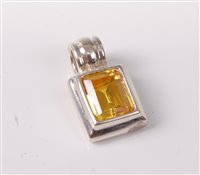 Lot 326 - A yellow hardstone pendant, the rectangular...