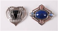 Lot 325 - Two silver Arts and Crafts style brooches, the...